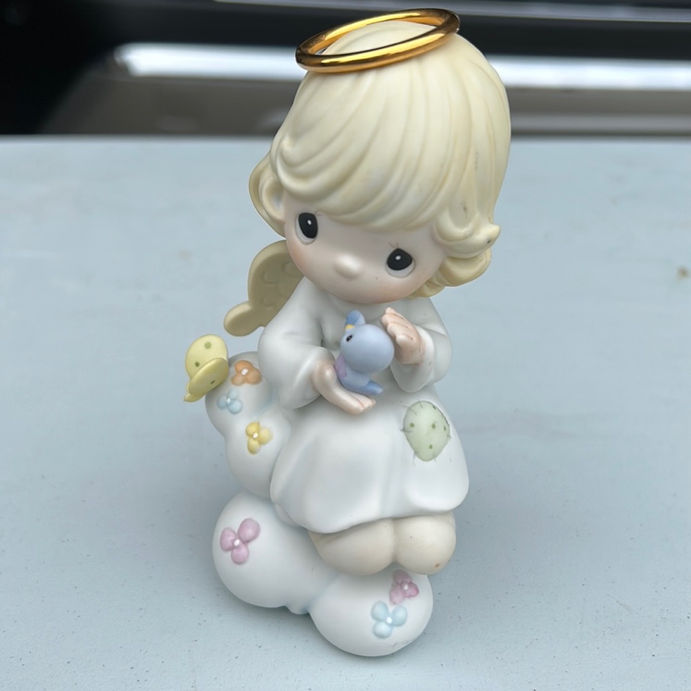Precious Moments Figurine: “A Loving Heart is Forever”.